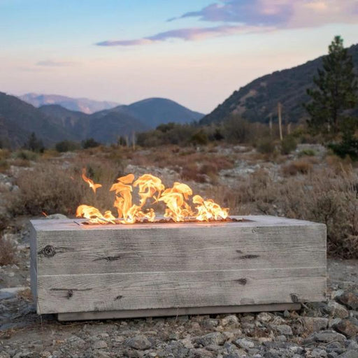 The Outdoor Plus Coronado Woodgrain GFRC fire pit in the mountains