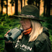 Alpen woman using Apex XP laser rangefinder binoculars